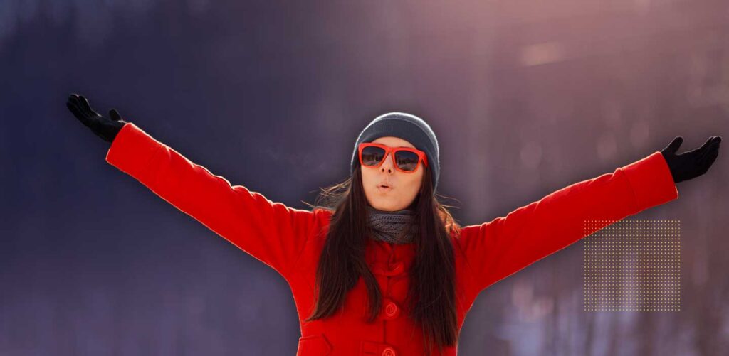 Women in the snow getting sunlight, making sure she is getting enough vitamin d in the winter and not getting vitamin d deficient.