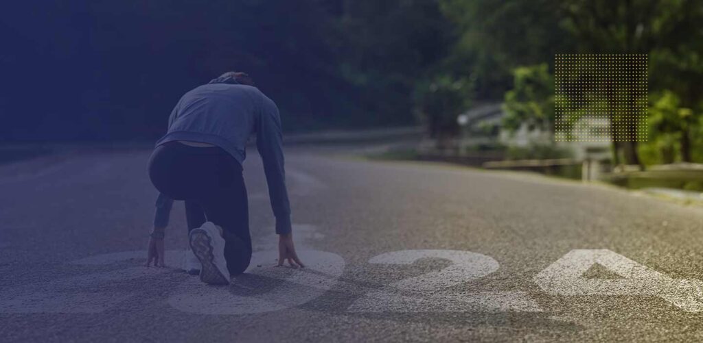 Person starting their day with a run in the mountains, embracing fresh air and higher heart rate for enhanced well-being in 2024."