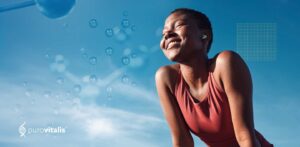 A healthy woman smiles joyfully while enjoying life outdoors, symbolizing the positive effects of nicotinamide riboside supplements on well-being.