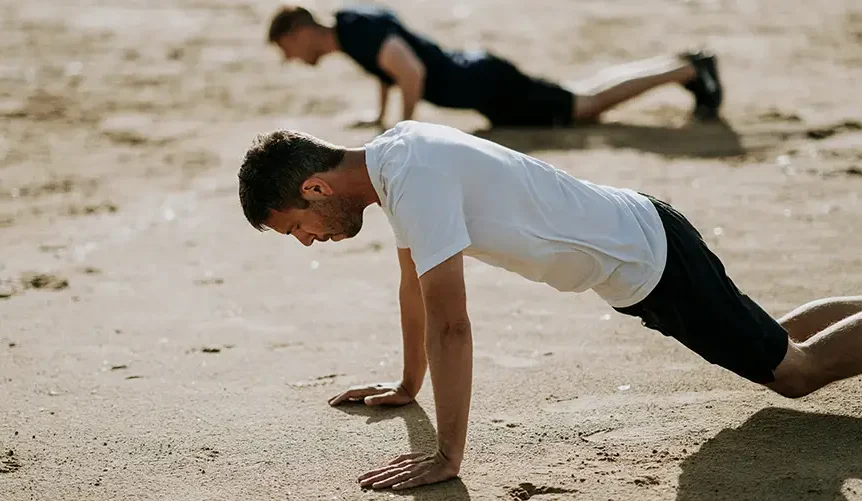 man exercise on beach