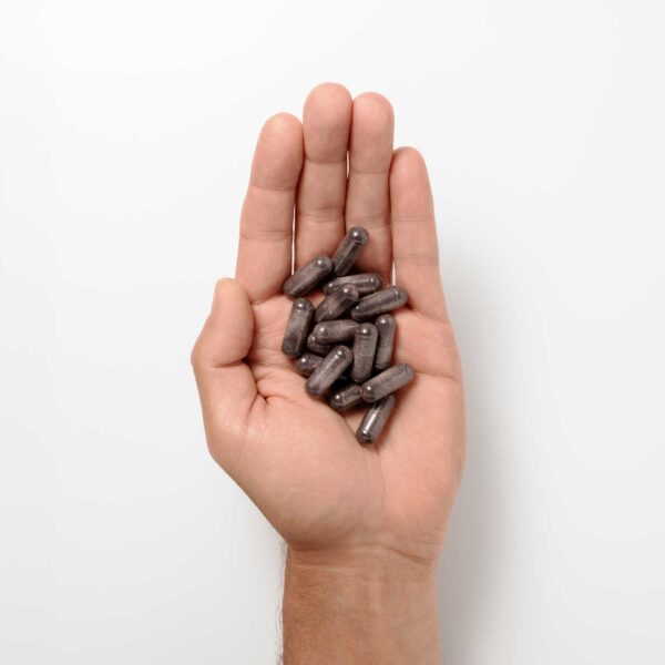 nad booster capsules in hand