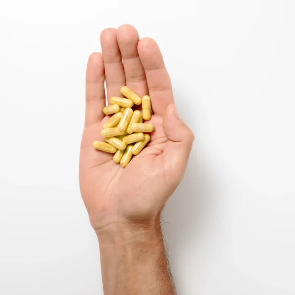 Berberine Balance capsules in an open hand